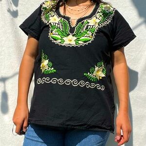 Embroidered flower and vines on black vintage shirt and tie on back 🖤